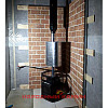 Печь с баком, дымоходом в парной