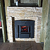 Печь Grill'D Cometa Vega Stone Window в доме