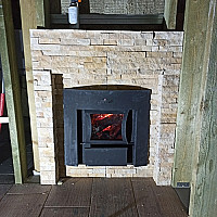 Печь Grill'D Cometa Vega Stone Window в доме